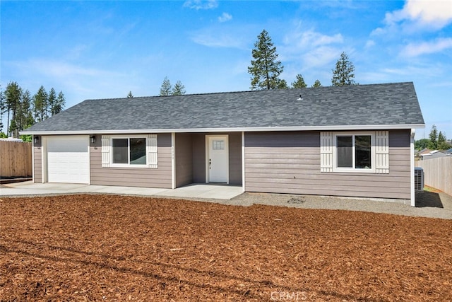 6333 Graham Rd, Paradise, CA 95969 - ranch-style house featuring fence, an attached garage, roof with shingles, and a patio area