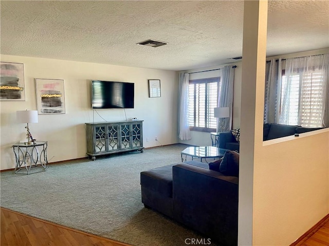 8127 Kingston Ave, Hesperia, CA 92345 - living room with baseboards, carpet floors, and a textured ceiling