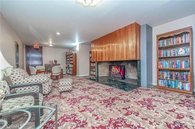 140 Linden Ave Unit 615, Long Beach, CA 90802 - living area featuring carpet, a fireplace, and baseboards