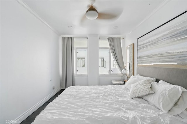 140 Linden Ave Unit 615, Long Beach, CA 90802 - bedroom featuring ornamental molding, baseboards, multiple windows, a ceiling fan, and dark wood finished floors