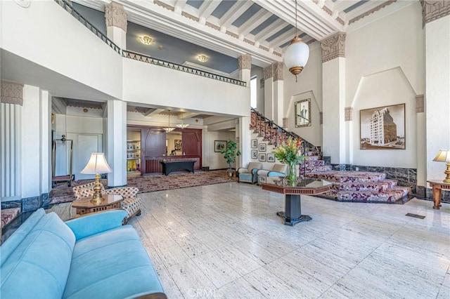 140 Linden Ave Unit 615, Long Beach, CA 90802 - community lobby featuring a high ceiling, stairs, and crown molding