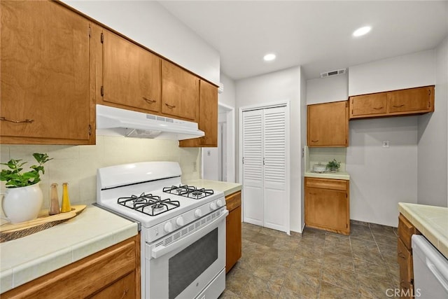 859 N Chester Ave, Pasadena, CA 91104 - kitchen featuring white appliances, under cabinet range hood, brown cabinets, tile countertops, and recessed lighting