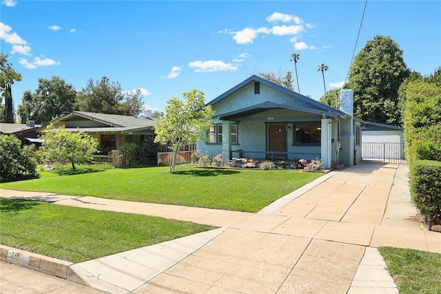 859 N Chester Ave, Pasadena, CA 91104 - view of front of house featuring a front lawn, covered porch, stucco siding, a gate, and a chimney