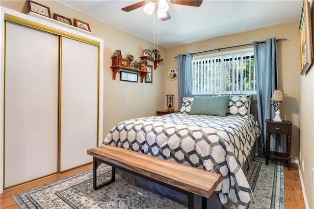 6031 Tripp Ln, Angelus Oaks, CA 92305 - bedroom featuring a closet, light wood-style flooring, and ceiling fan