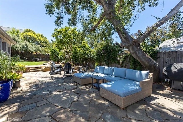 1443 Iris St, San Luis Obispo, CA 93401 - fenced backyard featuring outdoor lounge area, a patio area, and a grill