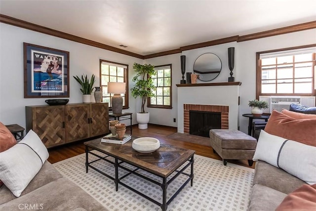 1443 Iris St, San Luis Obispo, CA 93401 - living area featuring wood finished floors, crown molding, a fireplace, cooling unit, and baseboards