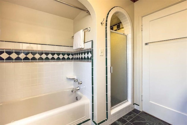 1443 Iris St, San Luis Obispo, CA 93401 - bathroom with marble look tile flooring, a stall shower, and a tub to relax in