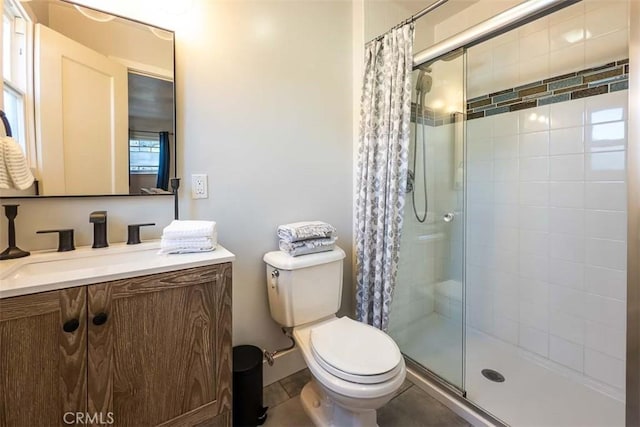 1443 Iris St, San Luis Obispo, CA 93401 - bathroom featuring a stall shower, toilet, vanity, and tile patterned floors