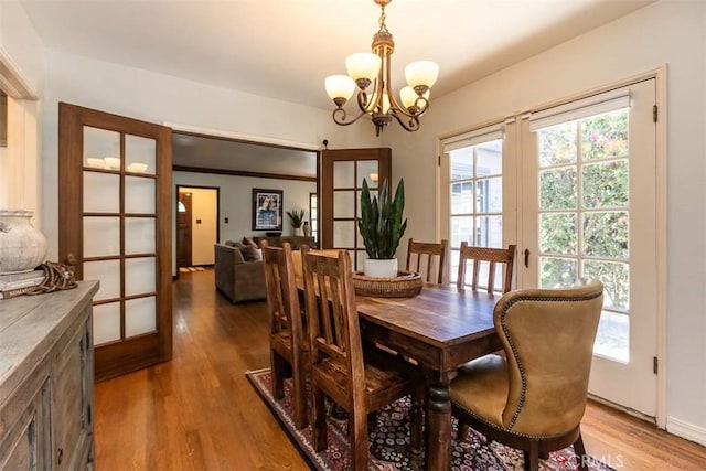 1443 Iris St, San Luis Obispo, CA 93401 - dining area featuring french doors, a chandelier, and light wood-type flooring