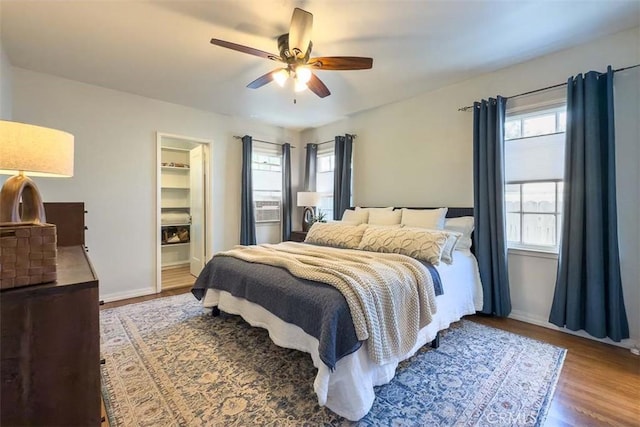1443 Iris St, San Luis Obispo, CA 93401 - bedroom with multiple windows, wood finished floors, baseboards, and a ceiling fan