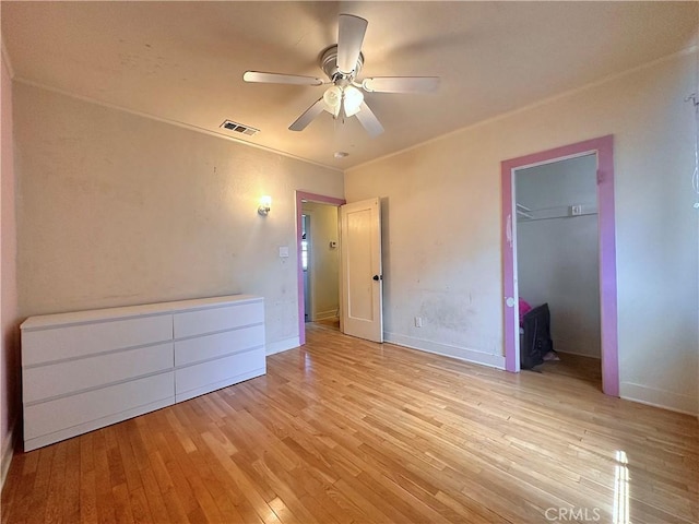 551 W Walnut Ave, Monrovia, CA 91016 - unfurnished bedroom featuring light wood-type flooring, a ceiling fan, a closet, and baseboards