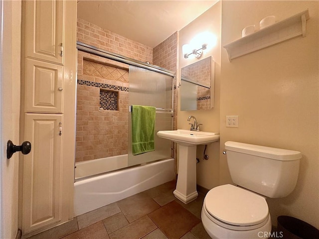 551 W Walnut Ave, Monrovia, CA 91016 - bathroom with toilet, enclosed tub / shower combo, tile patterned floors, and a sink