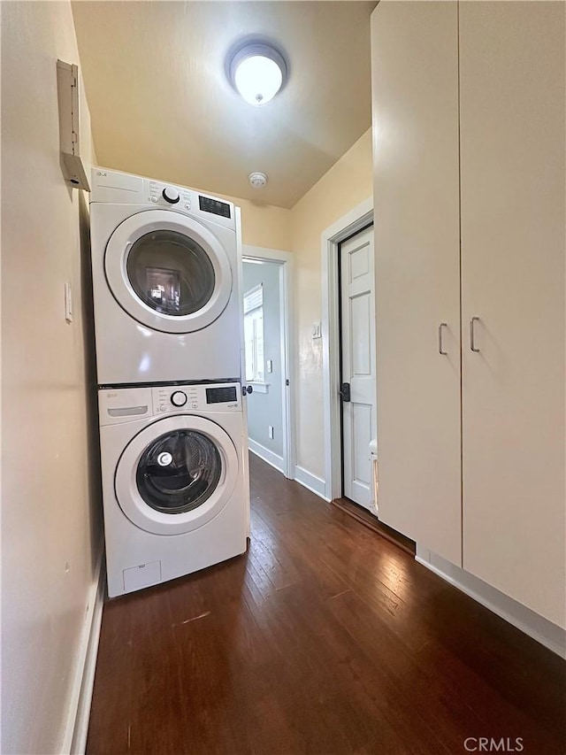 551 W Walnut Ave, Monrovia, CA 91016 - laundry area featuring stacked washer / dryer, dark wood-style floors, and baseboards