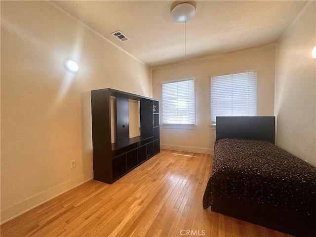 551 W Walnut Ave, Monrovia, CA 91016 - bedroom with light wood-style flooring and baseboards