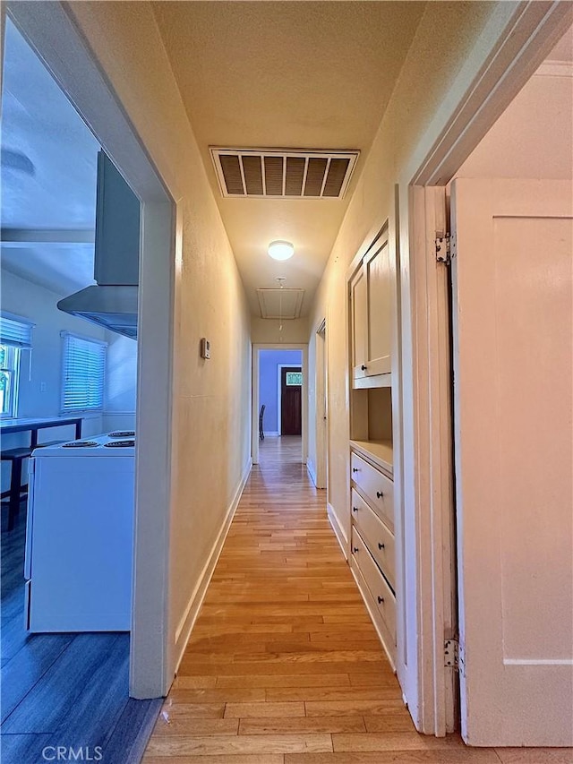 551 W Walnut Ave, Monrovia, CA 91016 - corridor featuring attic access, light wood-type flooring, and baseboards