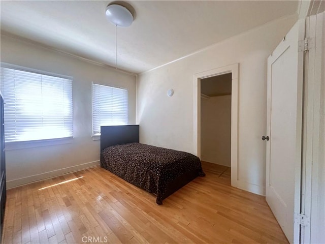 551 W Walnut Ave, Monrovia, CA 91016 - bedroom with light wood-type flooring and baseboards