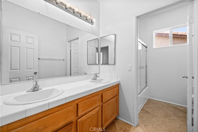 full bath featuring double vanity and enclosed tub / shower combo