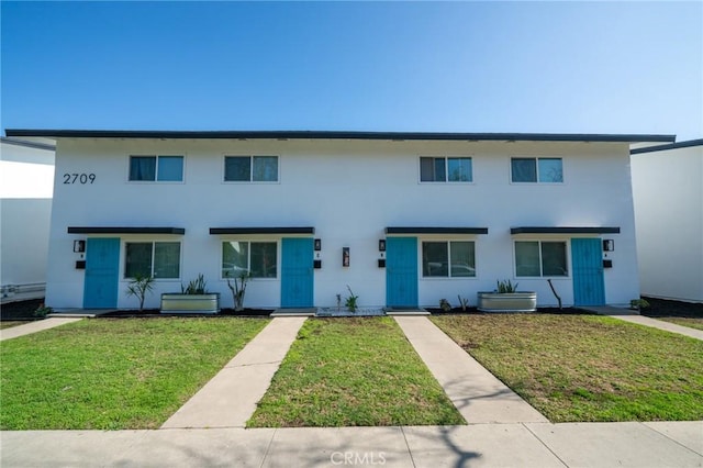 2709 S Baker St, Santa Ana, CA 92707 - townhome / multi-family property featuring a front yard and stucco siding