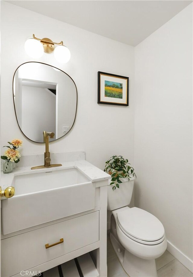 12528 Green Willow Dr, Garden Grove, CA 92845 - bathroom with vanity, toilet, and baseboards