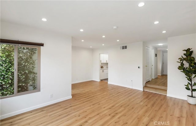 12528 Green Willow Dr, Garden Grove, CA 92845 - empty room with light wood finished floors, recessed lighting, baseboards, and a smoke detector