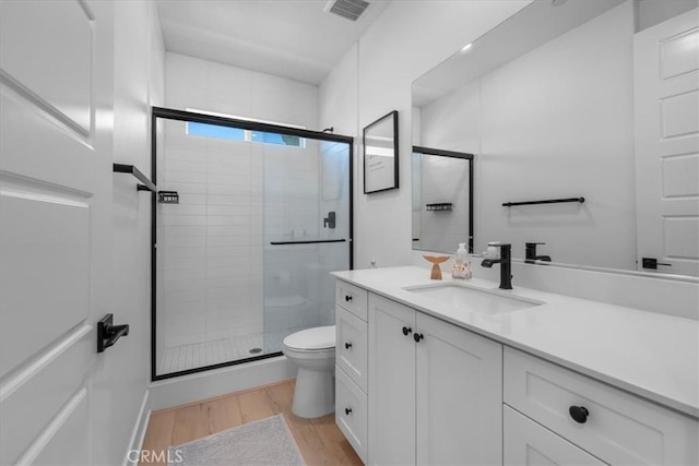 27659 S Rosewood Ln, San Pedro, CA 90732 - bathroom featuring toilet, a shower stall, wood finished floors, and vanity