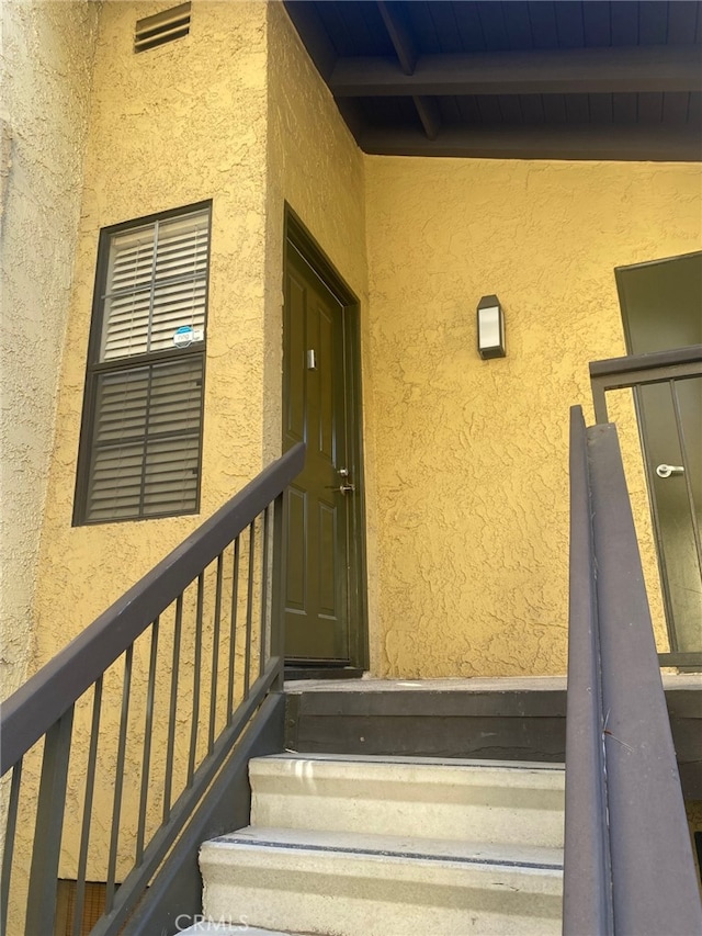 25641 Indian Hill Ln Unit C, Laguna Hills, CA 92653 - view of exterior entry with stucco siding