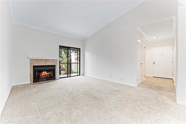 25641 Indian Hill Ln Unit C, Laguna Hills, CA 92653 - unfurnished living room with crown molding, carpet flooring, a fireplace, baseboards, and lofted ceiling