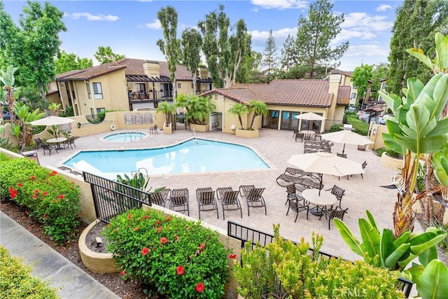 25641 Indian Hill Ln Unit C, Laguna Hills, CA 92653 - community pool featuring a hot tub and a patio