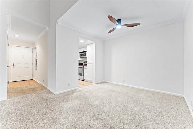 25641 Indian Hill Ln Unit C, Laguna Hills, CA 92653 - spare room featuring ornamental molding, light colored carpet, a ceiling fan, and baseboards