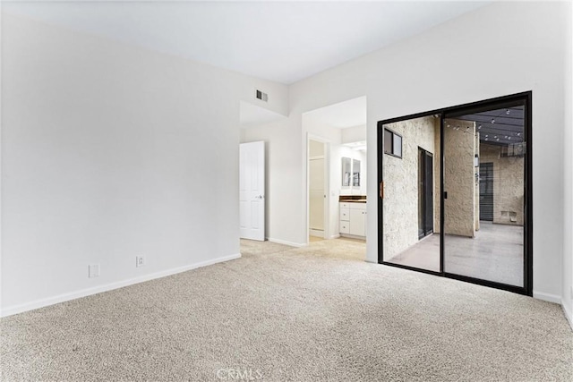 25641 Indian Hill Ln Unit C, Laguna Hills, CA 92653 - spare room featuring light carpet and baseboards
