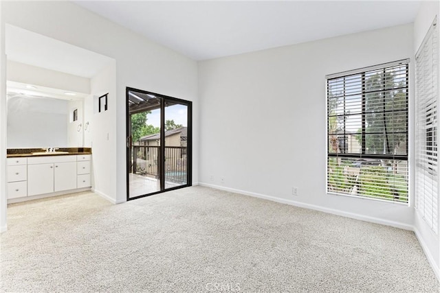 25641 Indian Hill Ln Unit C, Laguna Hills, CA 92653 - unfurnished bedroom featuring a sink, access to outside, and multiple windows