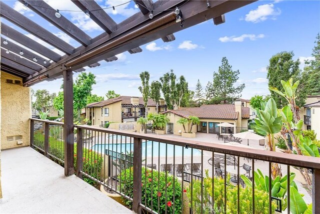 25641 Indian Hill Ln Unit C, Laguna Hills, CA 92653 - balcony with a residential view, a pergola, and view of pool area