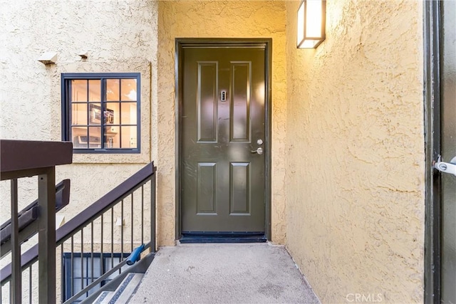 25641 Indian Hill Ln Unit C, Laguna Hills, CA 92653 - view of exterior entry with stucco siding