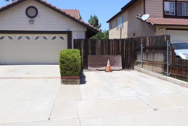 12601 Heartleaf St, Moreno Valley, CA 92553 - view of property exterior with driveway and a tile roof