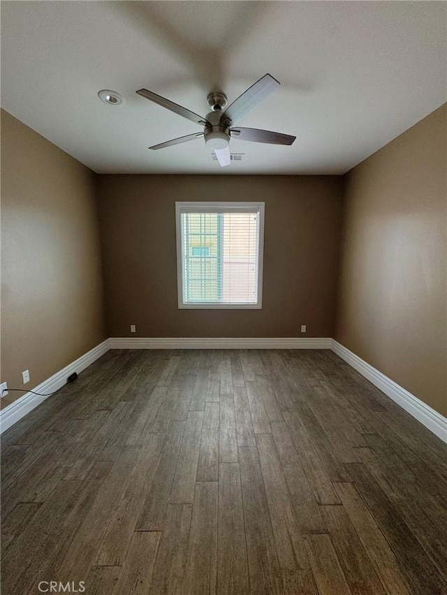 3397 Sequoia Ct, Perris, CA 92570 - spare room featuring dark wood-style flooring, ceiling fan, and baseboards