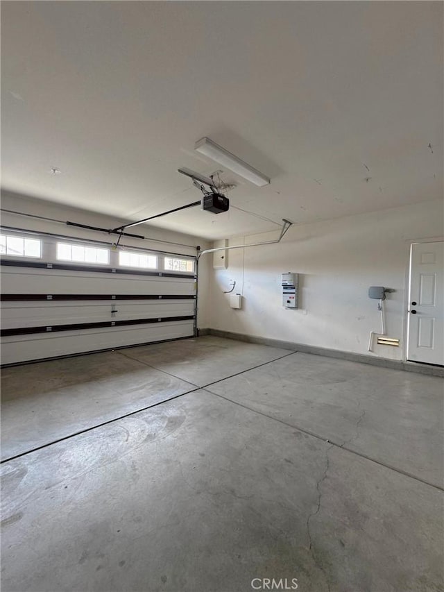 3397 Sequoia Ct, Perris, CA 92570 - garage featuring a garage door opener and baseboards