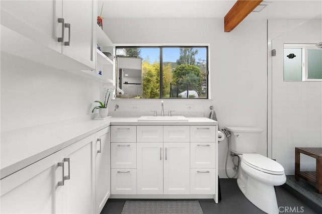 645 Griffith Way, Laguna Beach, CA 92651 - bathroom featuring toilet, a shower stall, beamed ceiling, and vanity