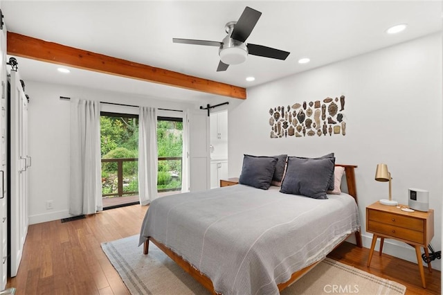 645 Griffith Way, Laguna Beach, CA 92651 - bedroom featuring a barn door, beamed ceiling, light wood finished floors, recessed lighting, and baseboards