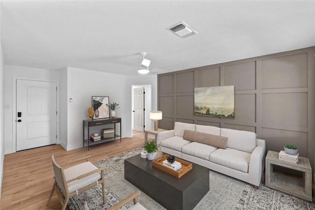 1935 N Mayfair Dr, Hanford, CA 93230 - living room with a decorative wall, light wood-style flooring, and ceiling fan