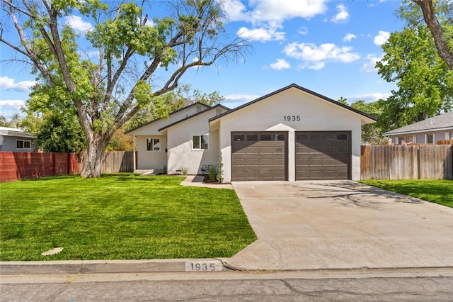 1935 N Mayfair Dr, Hanford, CA 93230 - ranch-style home featuring an attached garage, stucco siding, and concrete driveway