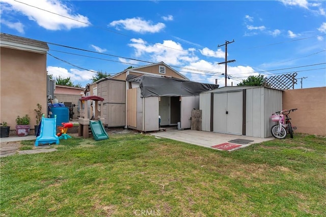 6038 Coke Ave, Long Beach, CA 90805 - view of green lawn with a shed and an outdoor structure