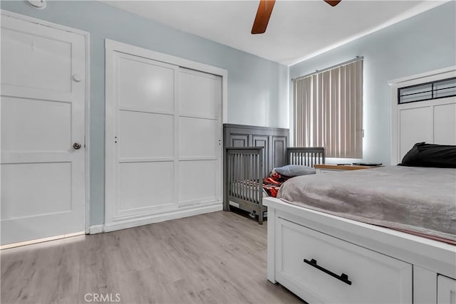 6038 Coke Ave, Long Beach, CA 90805 - bedroom with light wood-style floors, a decorative wall, a wainscoted wall, and ceiling fan