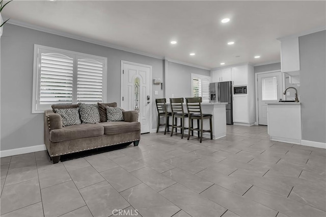 6038 Coke Ave, Long Beach, CA 90805 - living room featuring crown molding, recessed lighting, and baseboards