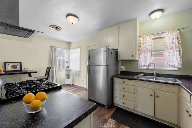 1980 N Sierra Way, San Bernardino, CA 92405 - kitchen with freestanding refrigerator, a sink, cream cabinetry, wall chimney range hood, and dark wood-style flooring