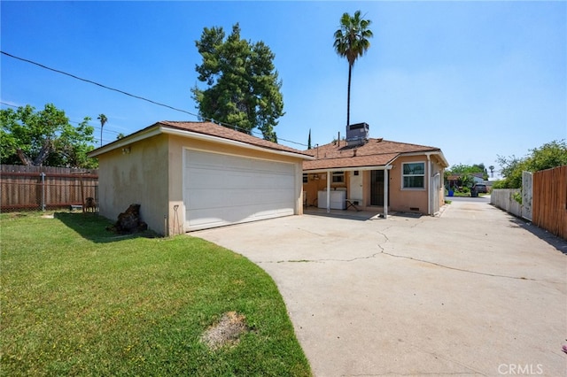 1980 N Sierra Way, San Bernardino, CA 92405 - view of front facade with a garage, stucco siding, and central AC