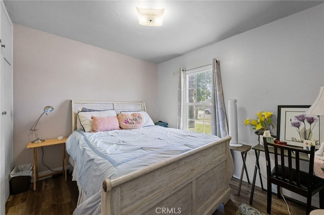 1980 N Sierra Way, San Bernardino, CA 92405 - bedroom featuring dark wood-type flooring and baseboards