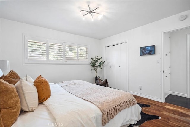 6028 Hart Ave, Temple City, CA 91780 - bedroom featuring a closet, wood finished floors, and baseboards