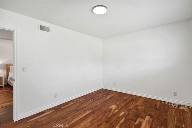 6028 Hart Ave, Temple City, CA 91780 - empty room featuring baseboards and dark wood-type flooring