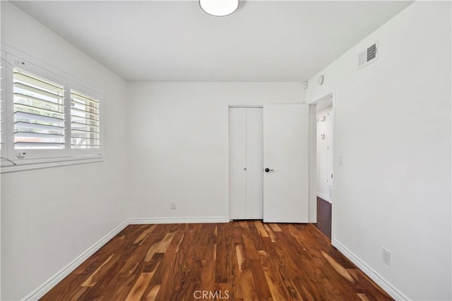 6028 Hart Ave, Temple City, CA 91780 - unfurnished bedroom with wood finished floors, a closet, and baseboards
