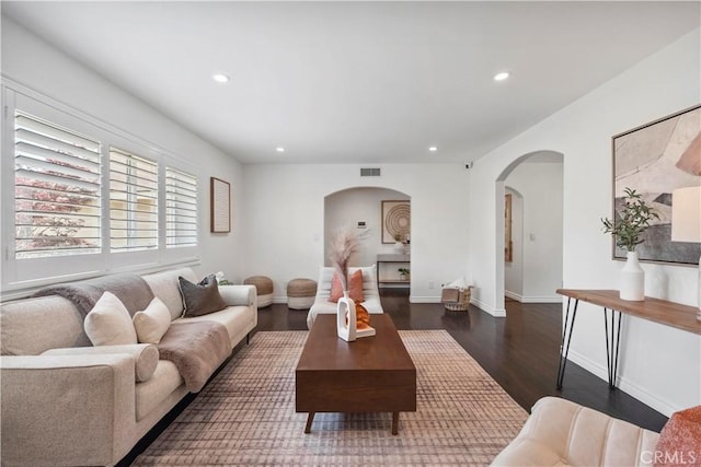 6028 Hart Ave, Temple City, CA 91780 - living area with arched walkways, dark wood finished floors, recessed lighting, and baseboards